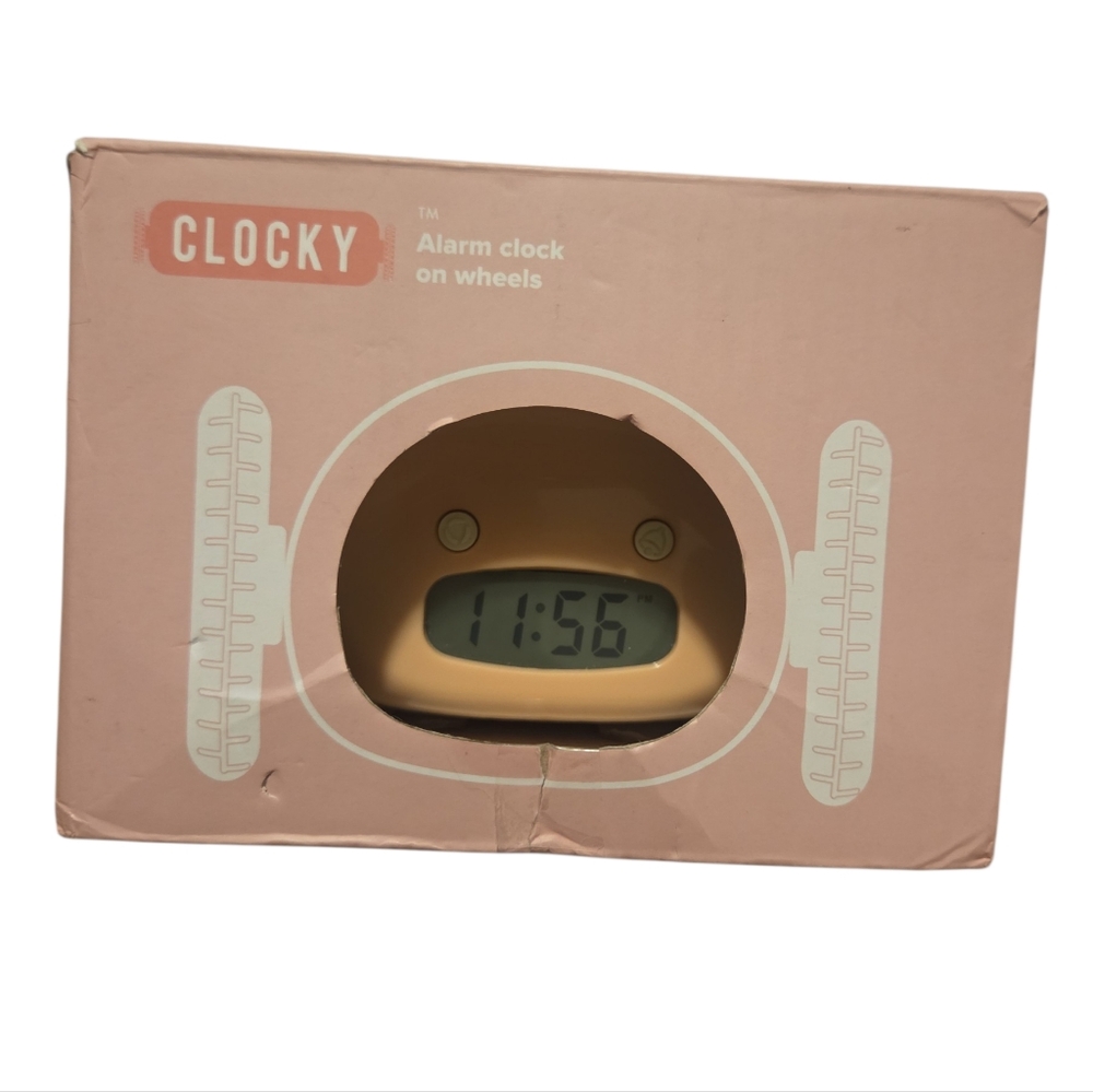 Pink Alarm Clock on Wheels